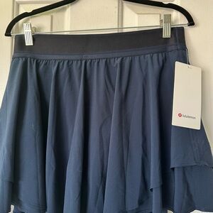 Lululemon. Court Rival HR skirt. Color Navy. 💙 size 10. *Long length. NWT